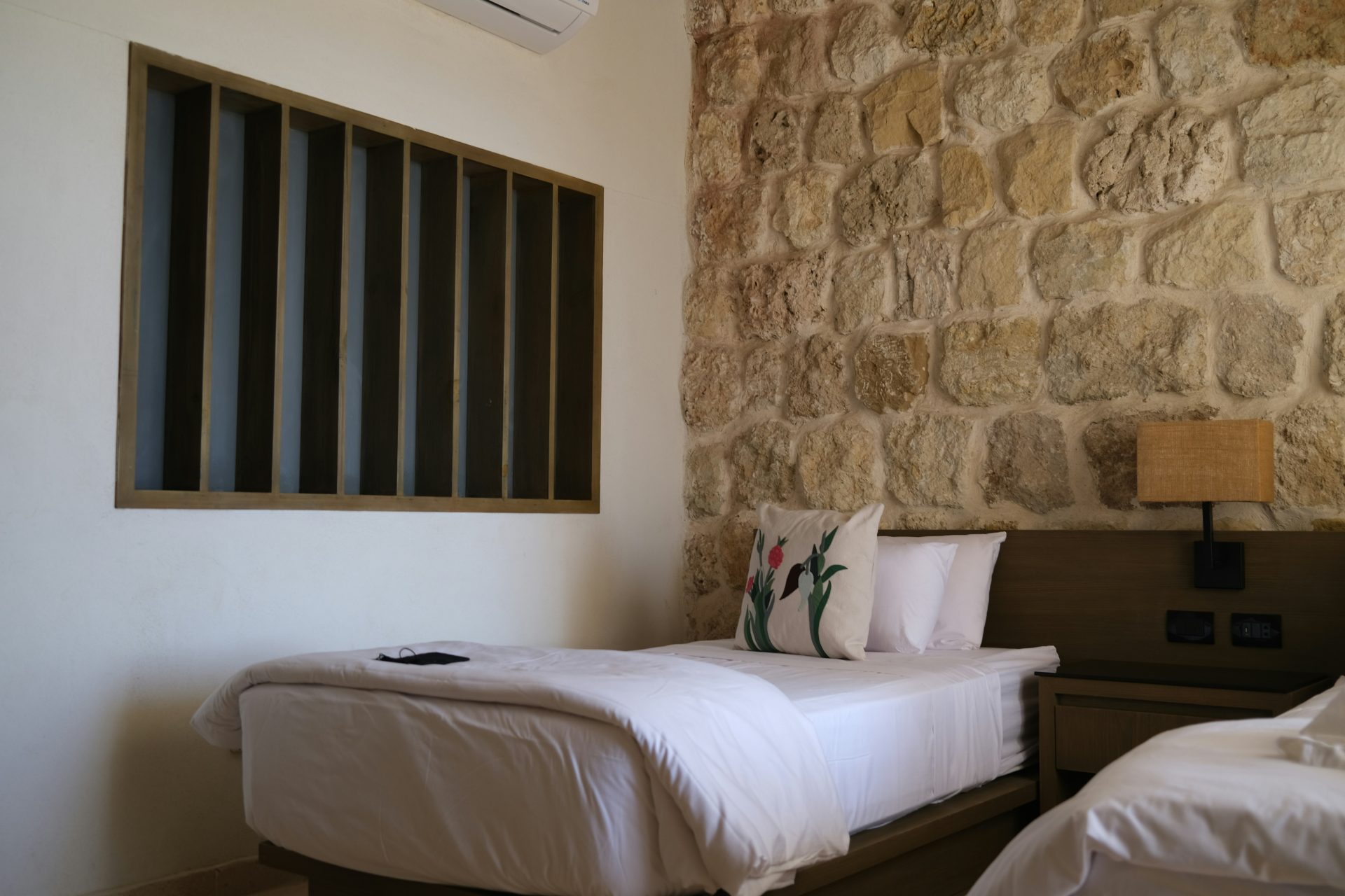 a couple of beds sitting next to each other in a bedroom
