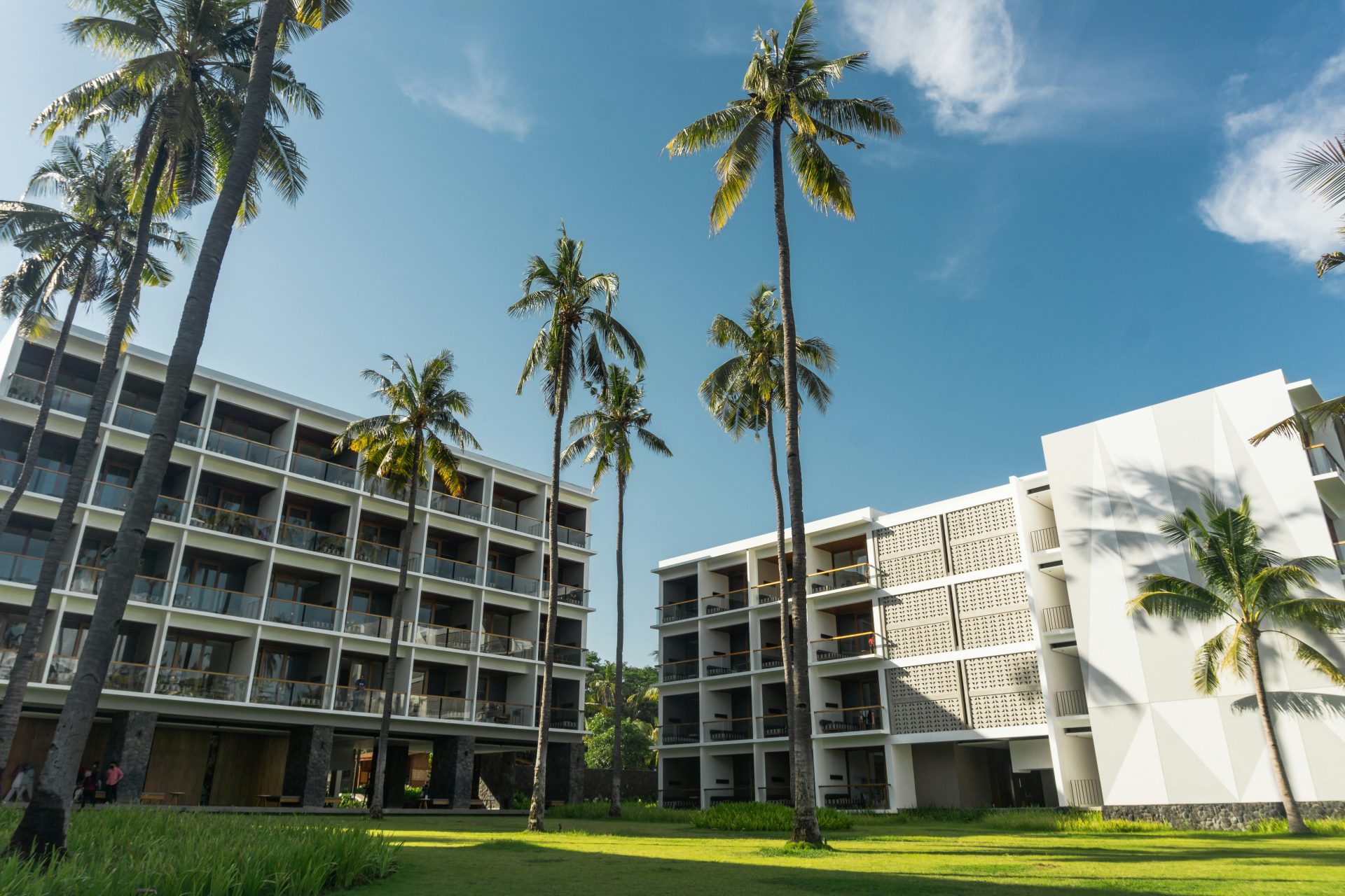 white concrete building near green grass field during daytime