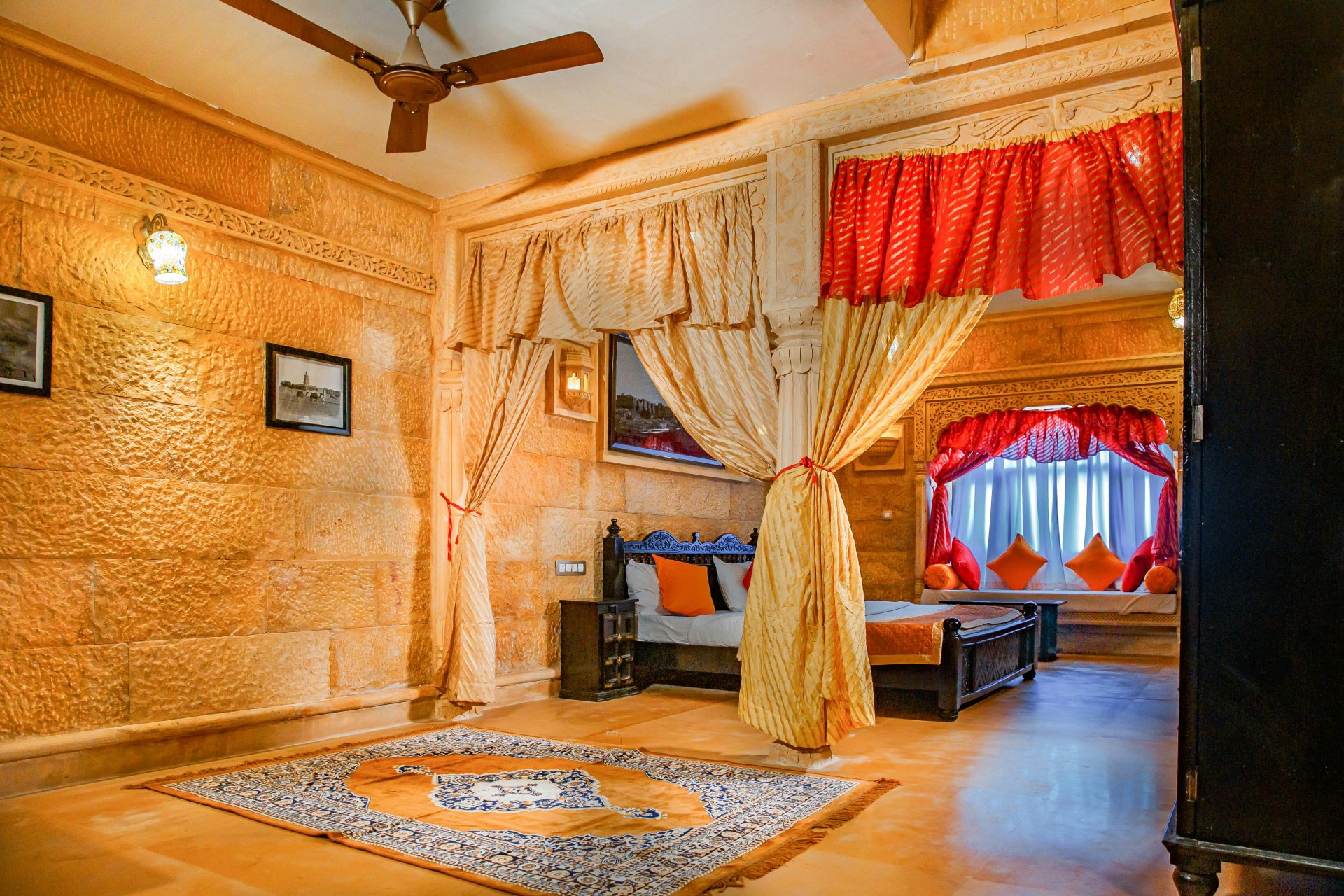 a bedroom with a bed and a fan
