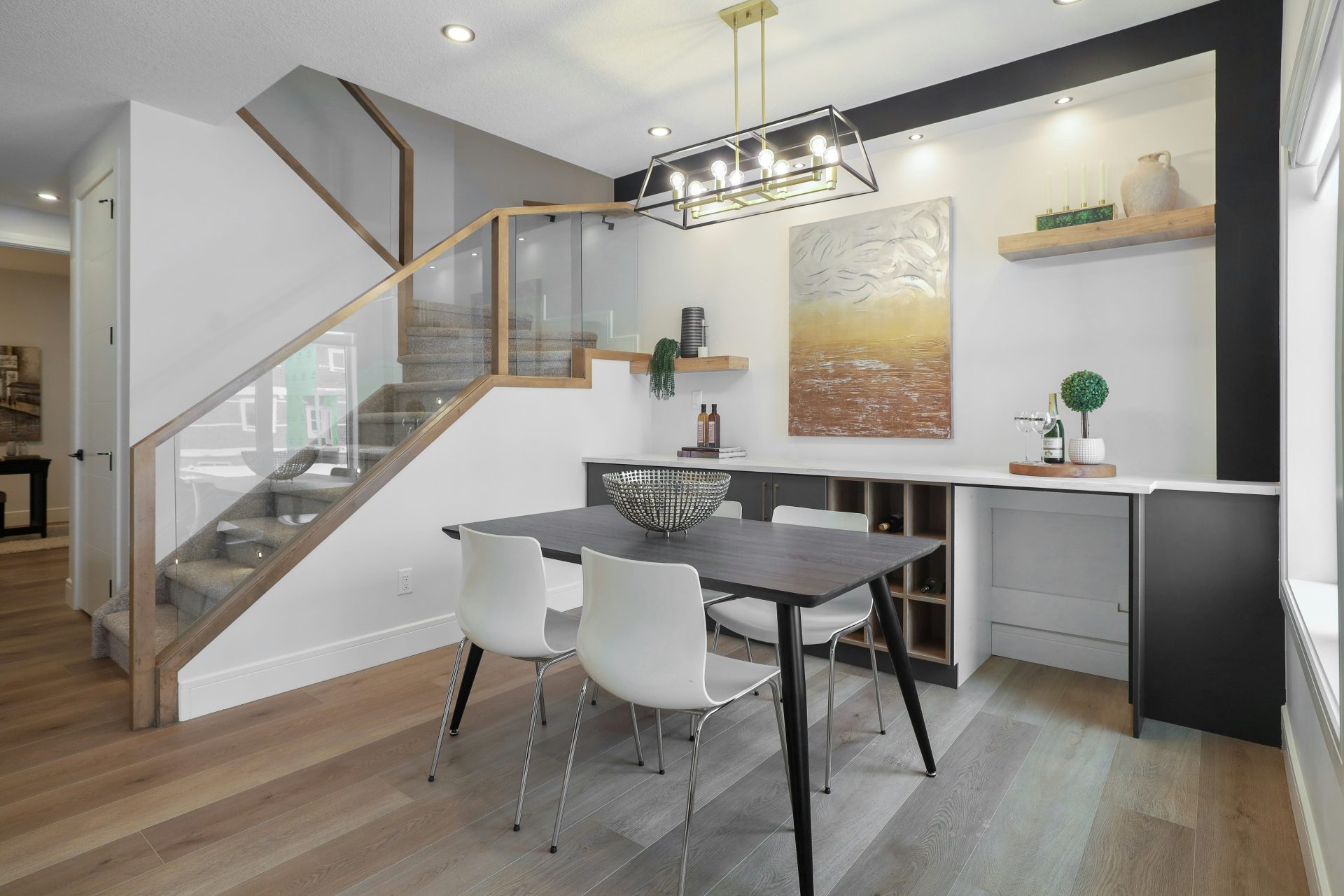 Modern dining area with a table and chairs.